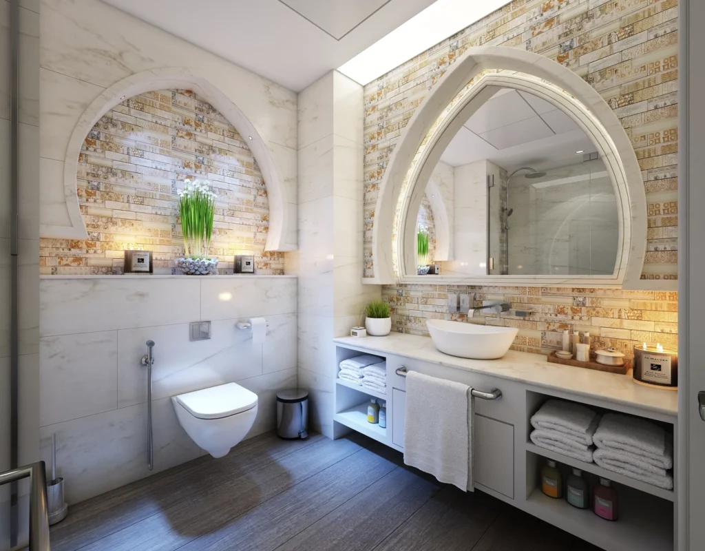 A bathroom with a toilet, sink and mirror.