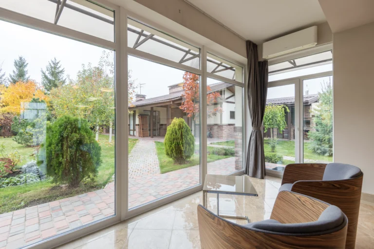 A living room with sliding glass doors and windows.