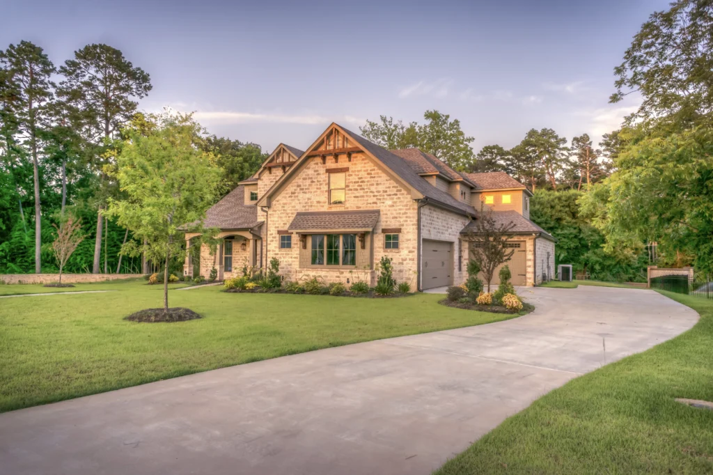 A large house with a driveway in front of it.